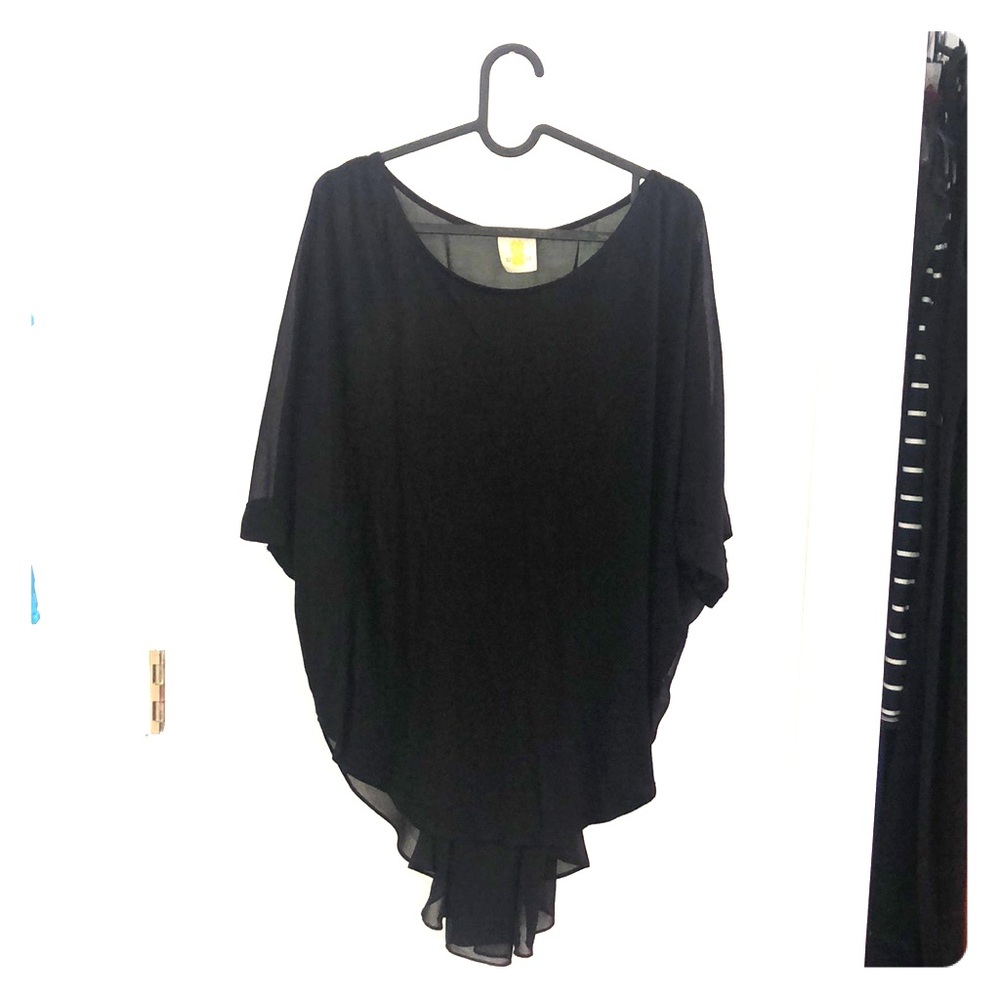 A black blouse with a delicate train on the back